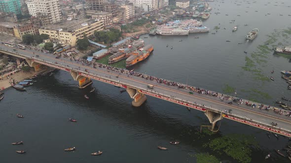 Aerial Over The Old Dhaka City with bridge and river port In Bangladesh. Parallax View alt