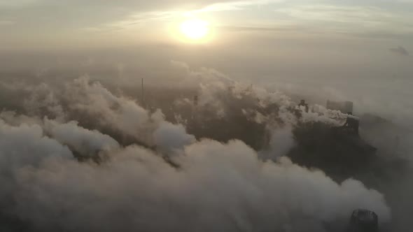 Aerial View. Emission To Atmosphere From Industrial Pipes. Smokestack Pipes Shooted with Drone.