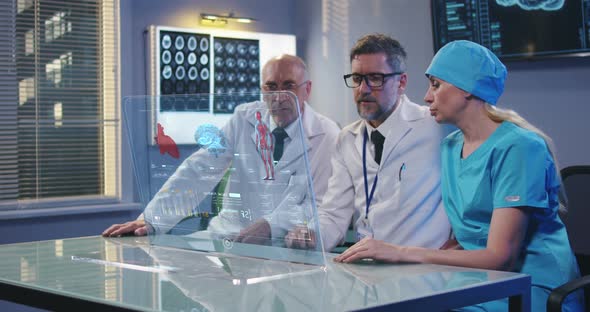 Doctors Using Holographic Display Screen alt