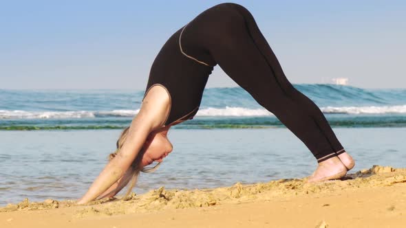 Sporty Girl in Black Tracksuit Practices Pilates in Morning alt