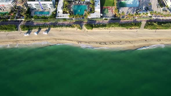 Aerial footage above the sea viewing the waves at Miami beach