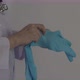 Wearing gloves. Male doctor wear blue rubber nitrile hands glove. Footage of Doc putting on gloves. - VideoHive Item for Sale