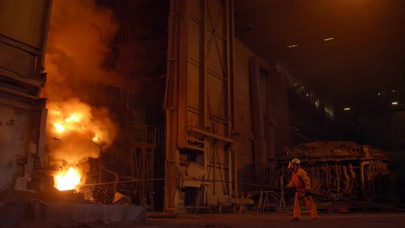 Metallurgist at Work By the Blast Furnance, Iron and Steel Works alt