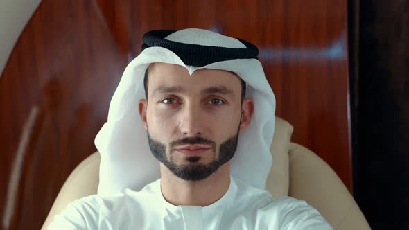 Arabian man flying on his Private jet to dubai. alt