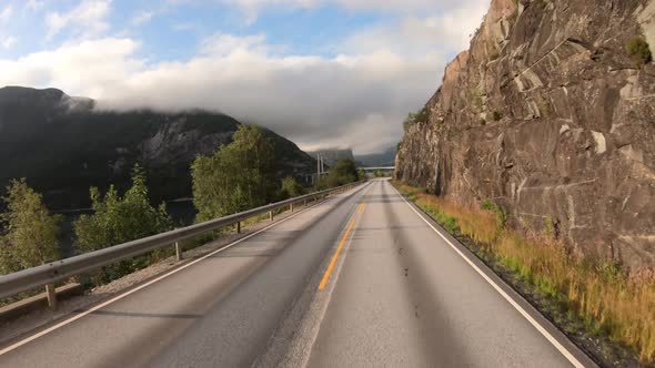 Vehicle Pointofview Driving a Car on a Road in Norway alt