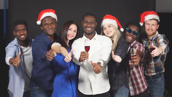 Mixed Race Group of Friends at the Christmas Party Smiling and Looking at Camera