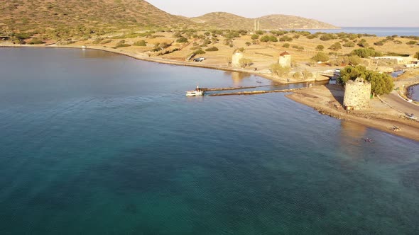 Aerial View of a Motor Boat in a Deep Blue Colored Sea. Kolokitha Island, Crete, Greece