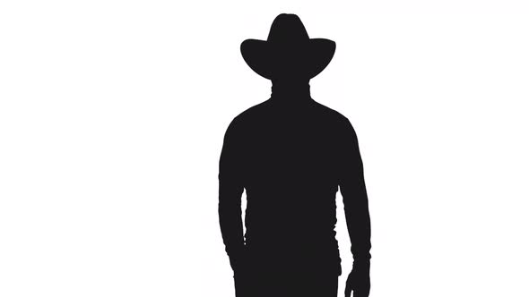 Black And White Silhouette Of Elegant Confident Man In Cowboy Hat Walking