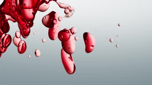 Vertical Video Cosmetic Red Oil Bubbles Emerging on White Background