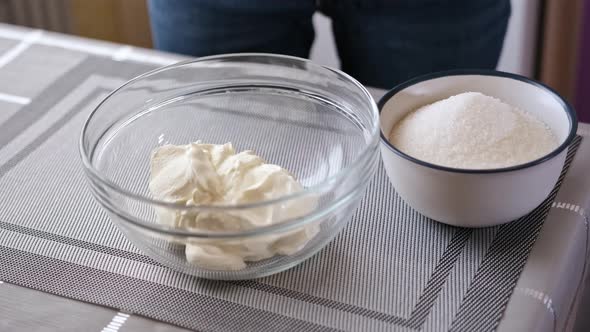 Making Cream for Cake  Woman Puts Sour Cream in Whisking Bowl alt