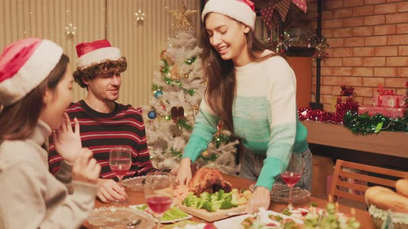 Group of Friends Enjoying Christmas Drinks  at home. alt
