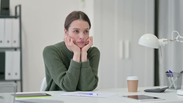 Young Woman with Documents Thinking alt