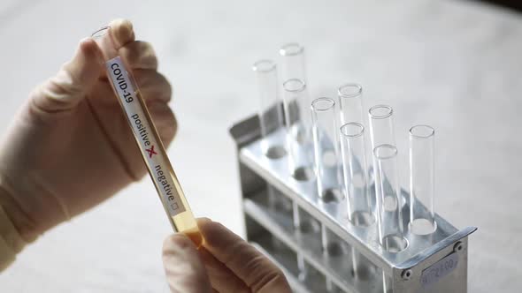 Doctor holding a coronavirus COVID-19 test tube