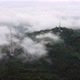Aerial rotation view three telecom tower in the foggy cloud - VideoHive Item for Sale