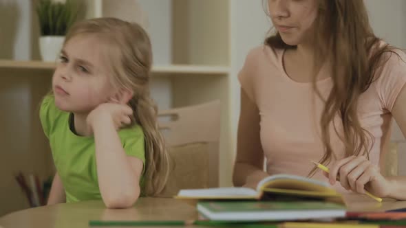 Upset Impatient Mother Making Bored Daughter to Do Homework, Homeschooling alt