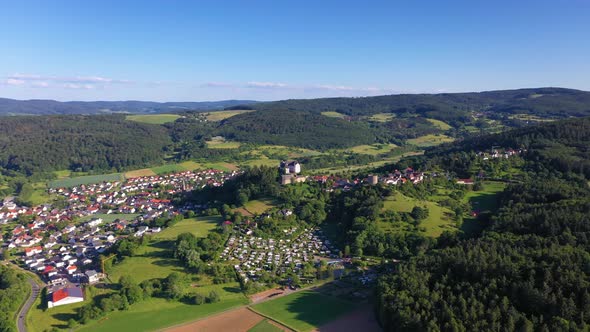 Drone video of the village Lichtenberg with castle in Germany during daytime alt