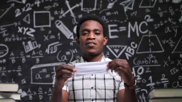 African-American teachers take a serious discussion about wearing masks. alt