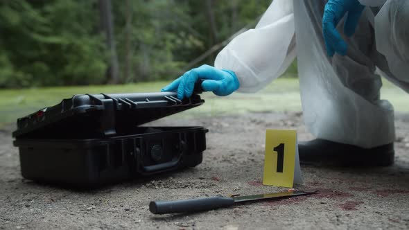Criminalists Discovering Proofs at Crime Scene Closeup Taking Evidence From Accident Murder alt