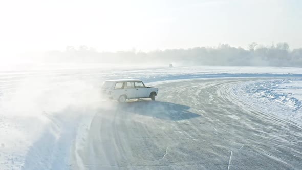 Slow Motion of a Racing Car Sliding on an Ice Track