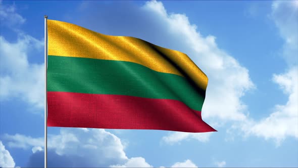 A yellow green and red bottom flag is flying over a blue sky alt