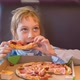 The girl eats pizza - VideoHive Item for Sale