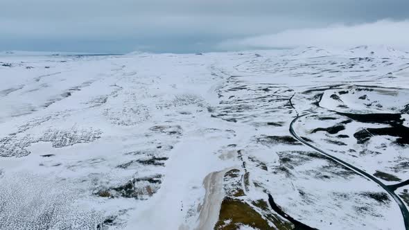 Aerial Video of an Empty Lava Fields and Huge Volcanic Mountain in Iceland alt