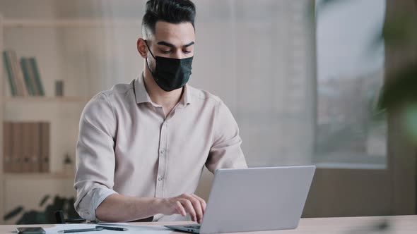 Hispanic Arab Male Business Man Masked Worker Programmer Typing on Laptop Search Online Information alt