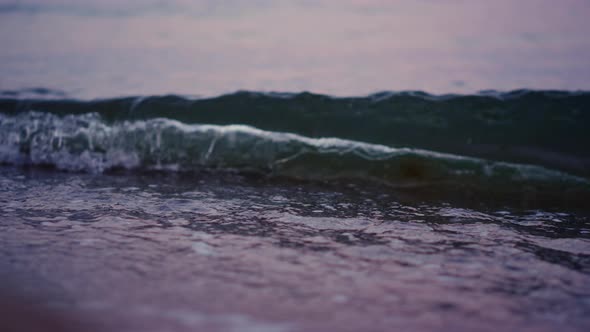 Ocean Waves Splashing Sandy Beach in Slow Motion alt