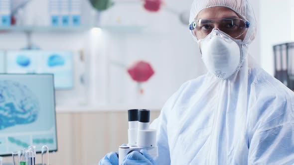 Close Up Portrait of Chemist Researcher in High Security Laboratory alt