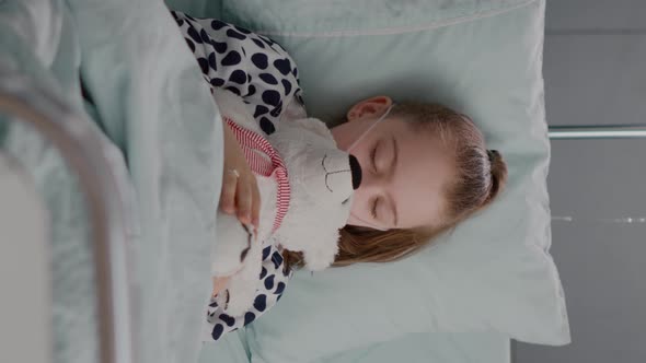 Vertical Video Portrait of Tired Sick Child Sleeping After Suffering Medical Recovery Surgery alt