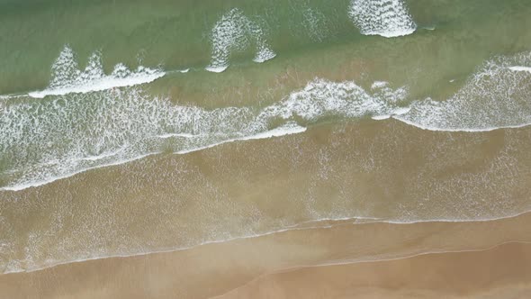 Pleasant clean white rock beach Portrush Northern Ireland aerial alt