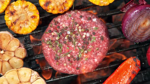 Super Slow Motion Top Shot of Falling Fresh Minced Meat with Spices on Grill at 1000 Fps alt
