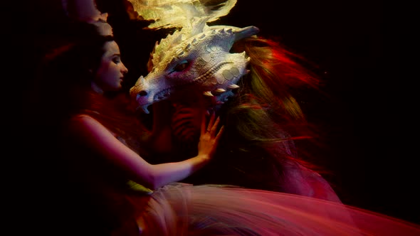 Love of Woman and Dragon Mysterious Underwater Shot with Lady and Subaquatic Beast alt