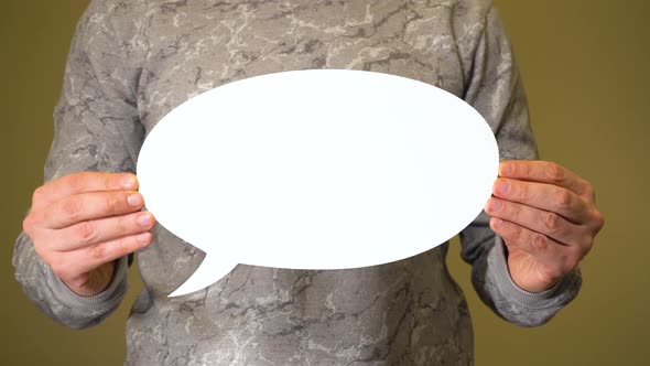 Man Holding White Talk Cloud in Hands