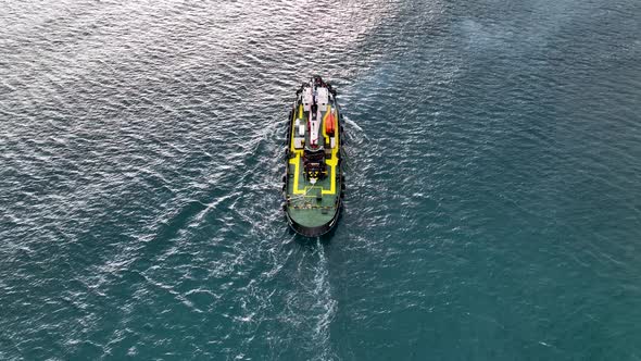 Ship tug sails out of port aerial view Turkey Alanya 4 K alt