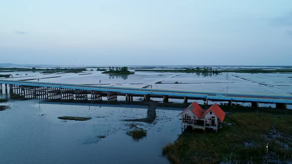 Aerial view Drone shot of Bridge(Ekachai bridge)Colorful Road bridge cross the lake alt