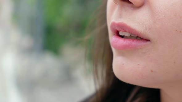 Woman smokes cigarette alt
