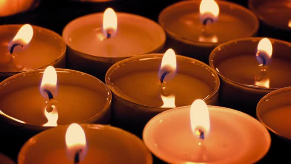 Many Candles Burning Closeup alt