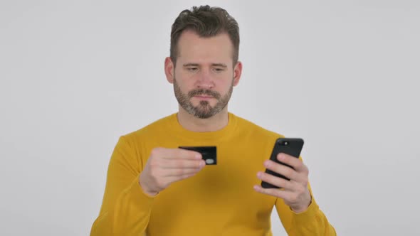 Portrait of Middle Aged Man Having Online Payment Success on Smartphone alt