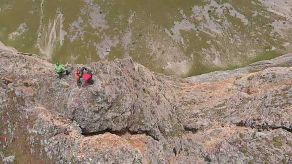 Aerial Shot of Climbers Take Off the Load From the Rock. Rescue Operations in the Mountains