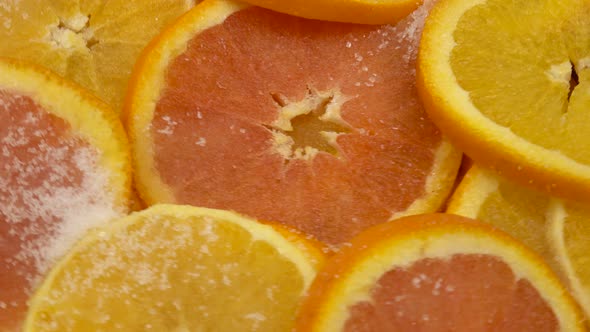 Preparation of orange jam, orange slices with sugar in a copper basin