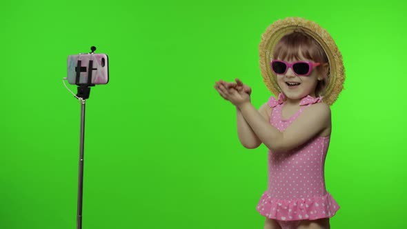 Girl Child Makes Selfie Vlog, Blogging, Video Call on Mobile Phone. Vacation Sea alt
