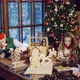 Two Elves are Sitting at the Table with a Little Boy and Girl and Show them Christmas Gifts - VideoHive Item for Sale