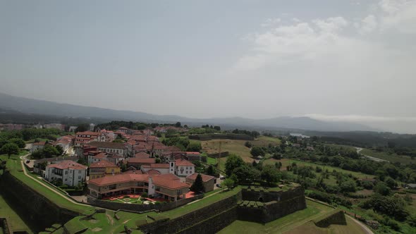 Aerial view of ancient fortress walls and village of Valença do Minho on sunny day. Border Portugal alt