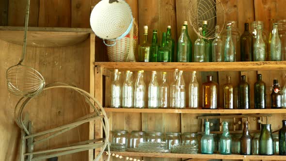 Jar Bottles with Glass and Carboy, Traditional Moravia Cottage Old Folk Hana. Interior of Peasant