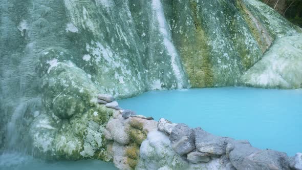 Geothermal pool and hot spring in Tuscany, Italy. Bagni San Filippo natural thermal waterfall in the alt