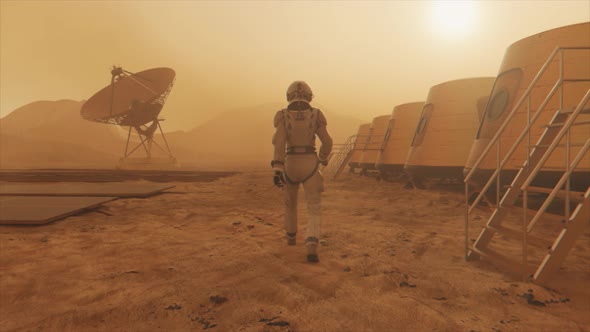 Astronaut on the Planet Mars Making a Detour Around His Base alt