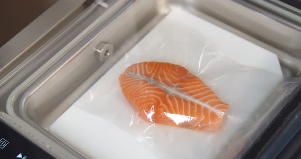 Automated Sealing Machine Packing Salmon Steak in Plastic Bag alt