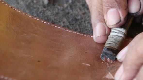 craftsman when carving leather for decoration