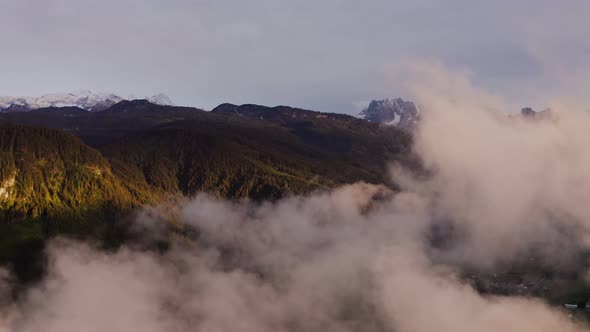 Panoramic View of a Picturesque Mountain Valley with a Village in a Lowland alt
